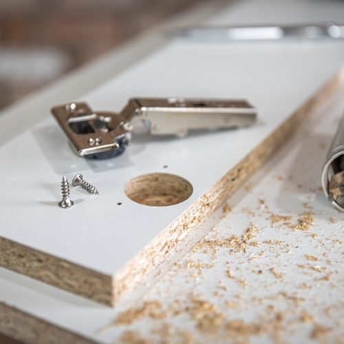 Close-up of a self-tapping screw, wood screw in the carpenter's craft.